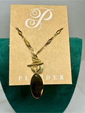 Plunder gold tone, oval necklace with toggle chain. Engravable.